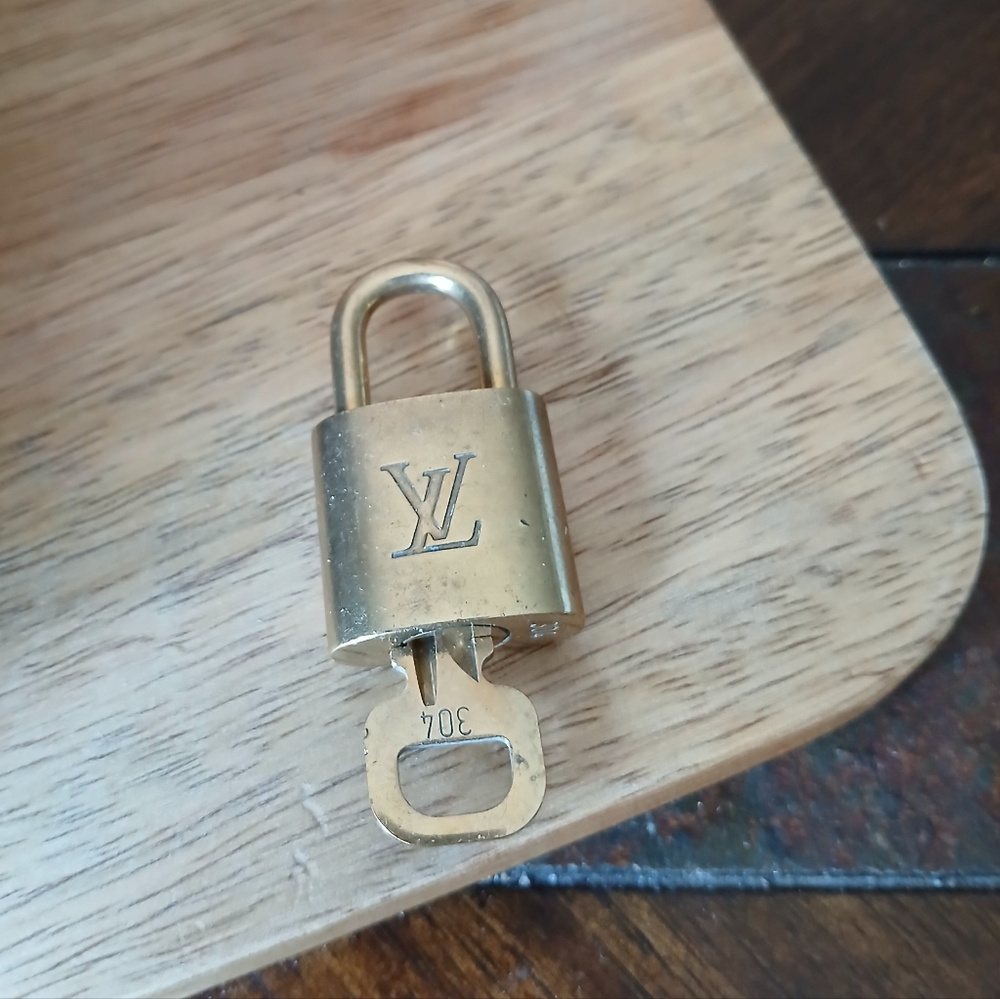 LOUIS VUITTON Padlock with Key in Gold tone